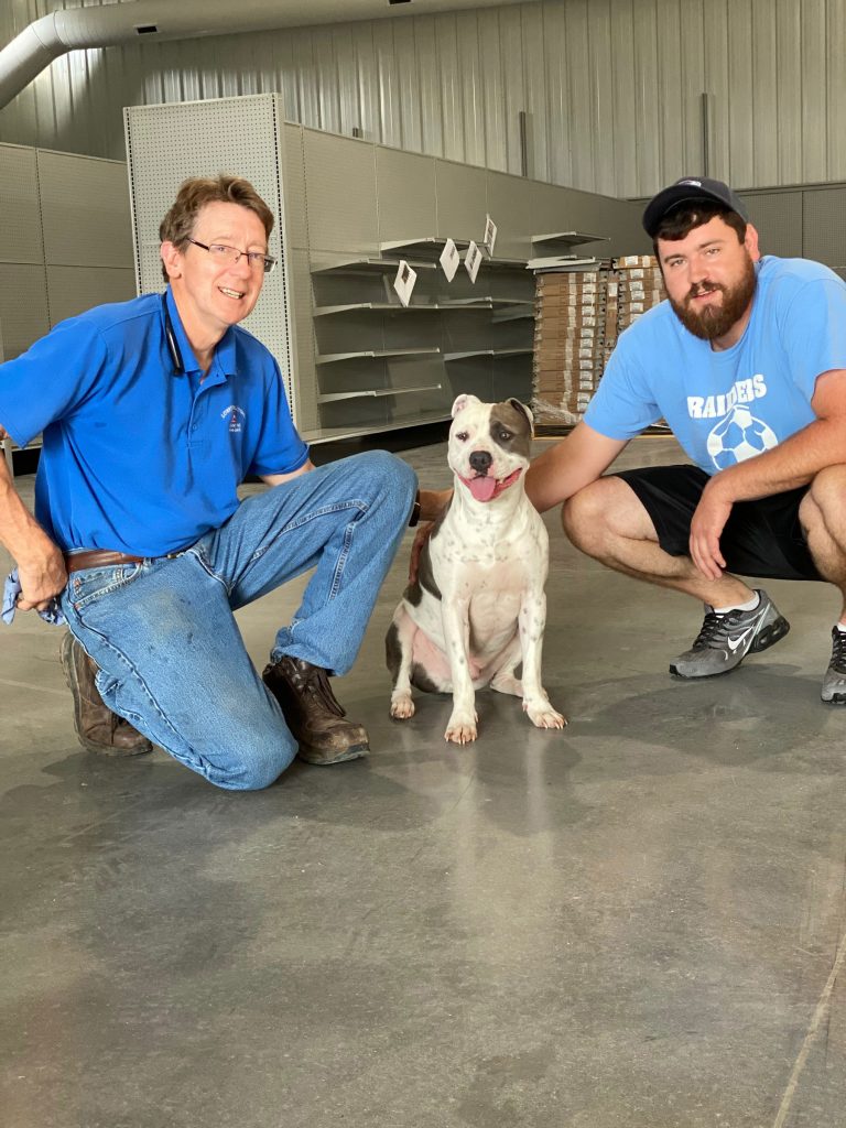 Scott and Josh Lowry's pictured in new store with dog